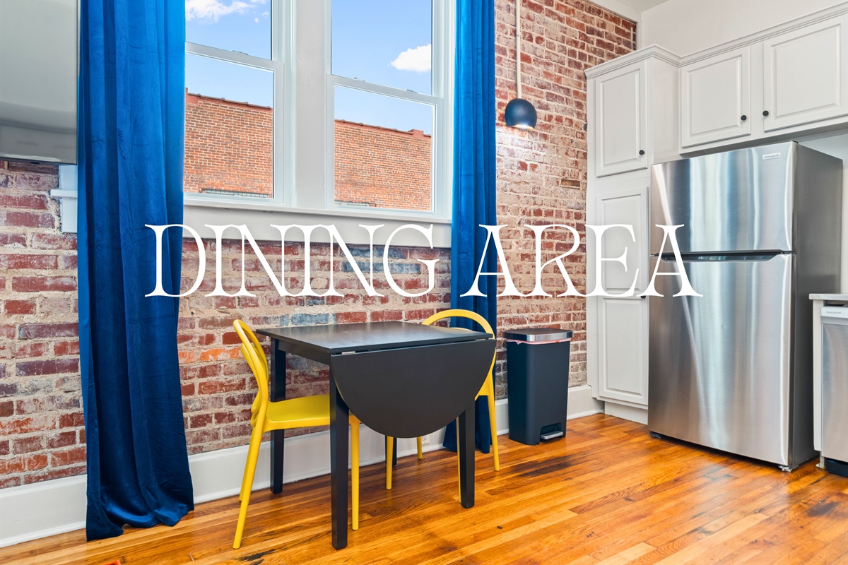 A bright and colorful dining area offers a cheerful space to gather, share meals, and soak in the studio's vibrant vibe.
