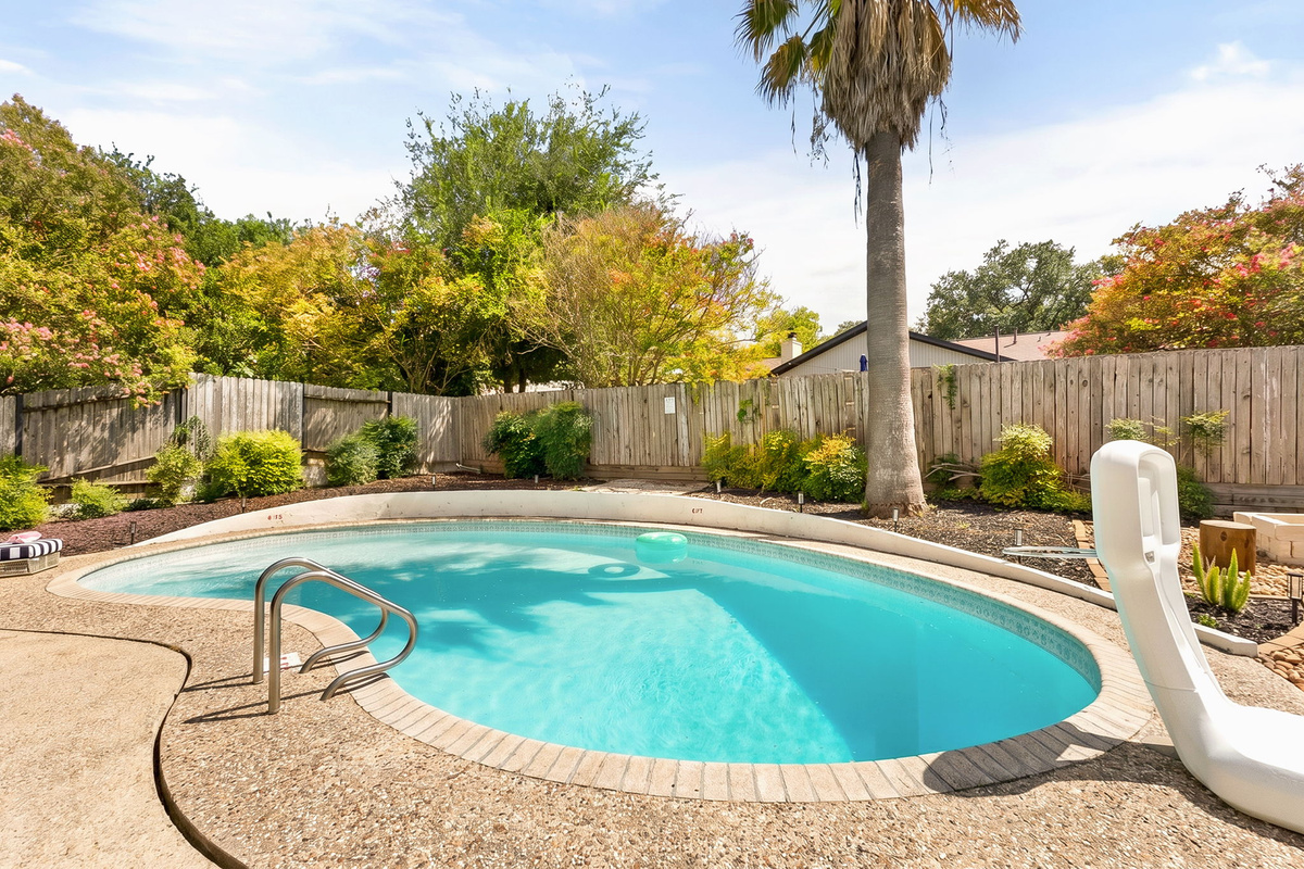 Dive into vacation mode with this inviting private pool.