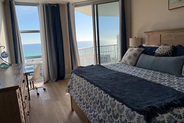 Master bedroom, access to balcony and beautiful Gulf view facing east. Black out curtains ensure ample rest.