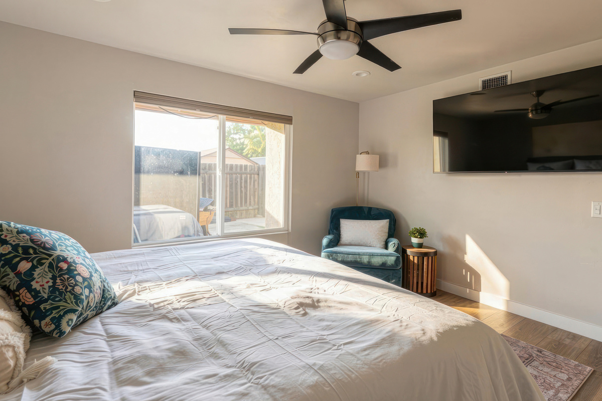 Master bedroom with reading corner and tv