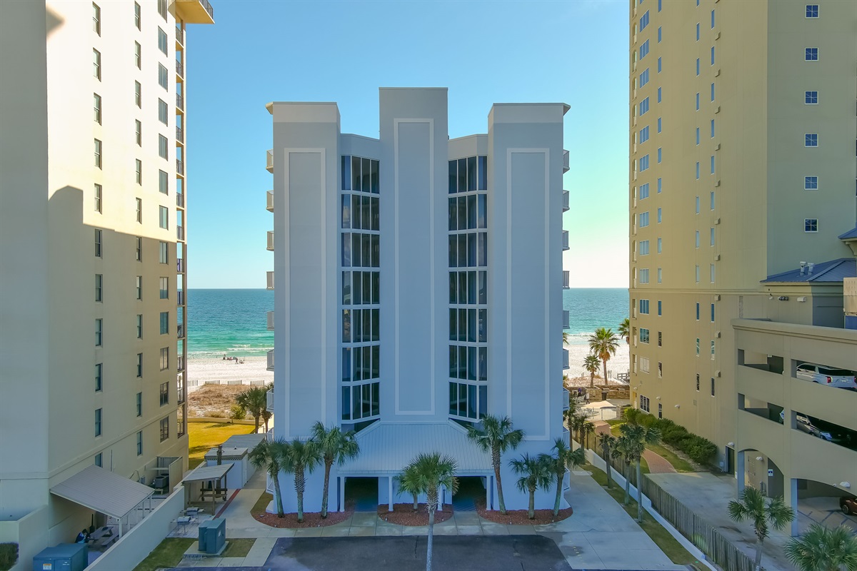 Soaring architecture against a backdrop of clear blue skies and swaying palm trees. Experience the allure of bayfront living.