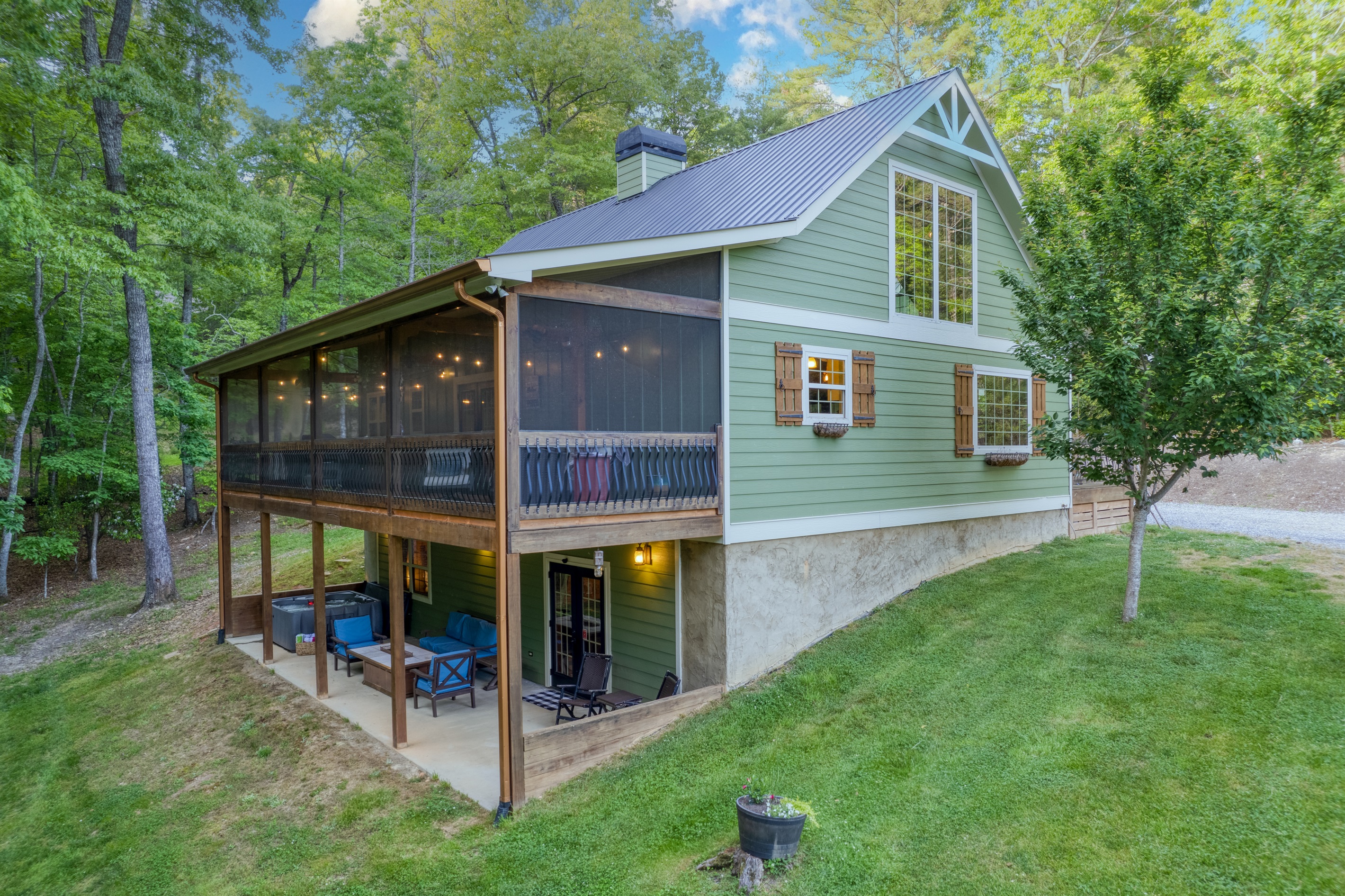 Screened in porch, patio with fire table or relax in the hot tub - so many amenities!