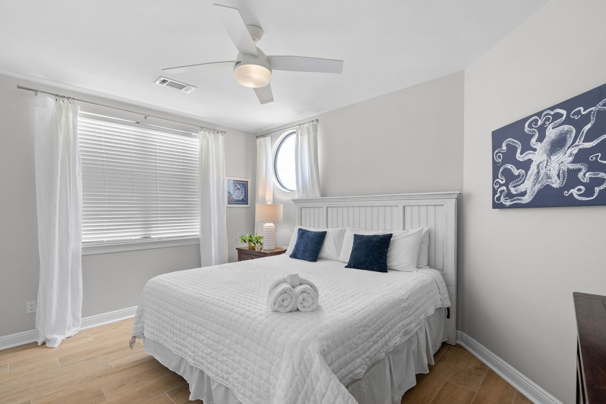 1st Floor Guest Bedroom. A charming bedroom offering comfort and a restful ambiance.