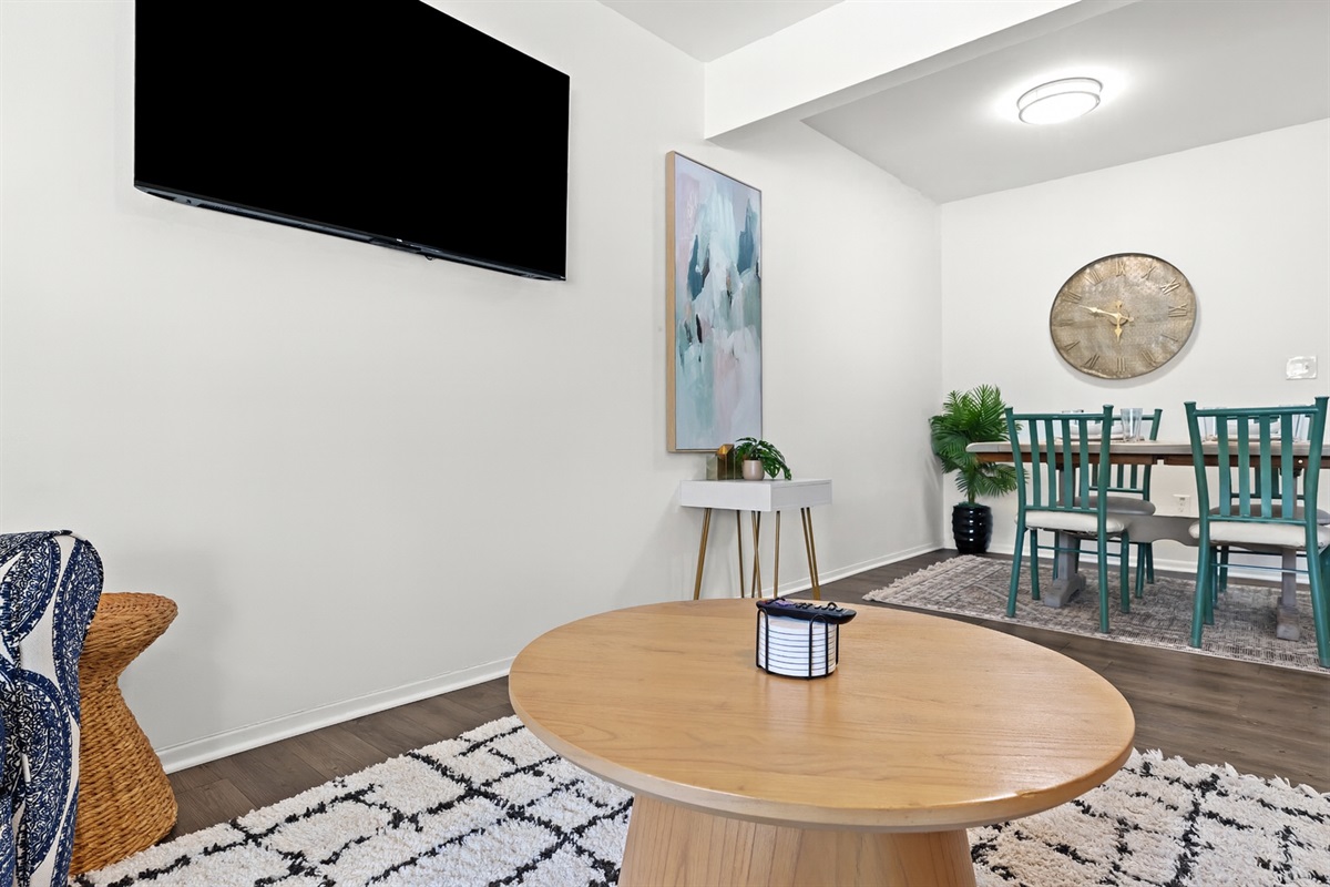 The bright, open living area is perfect for relaxing with family or winding down with a movie.