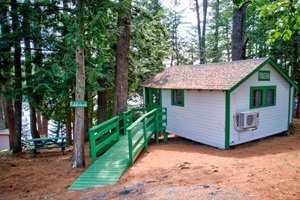 Side entrance , with stairs bridge and lake in the background