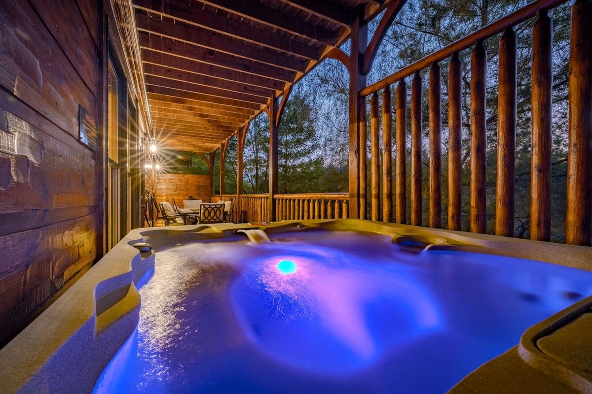 rivate 7-seat hot tub on covered lower deck. Gatlinburg cabin with hot tub &mdash; perfect for group getaways, family reunions, and tournament teams.