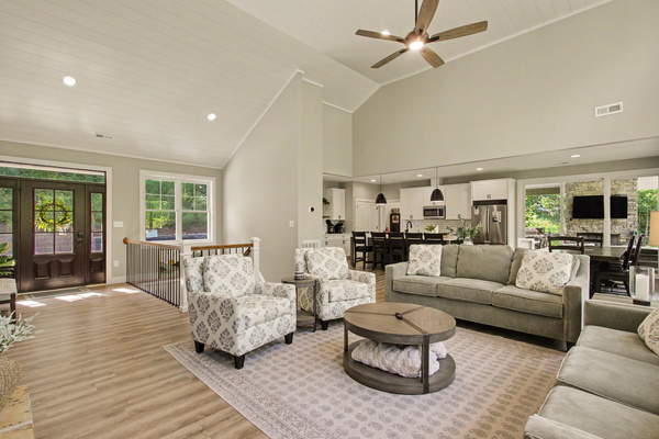 Great room seating area, dining, and kitchen access