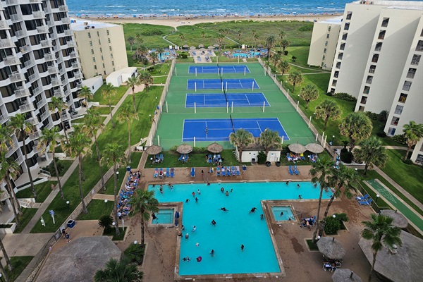 Beautiful view from the balcony overlooking the three pools and four tennis courts.