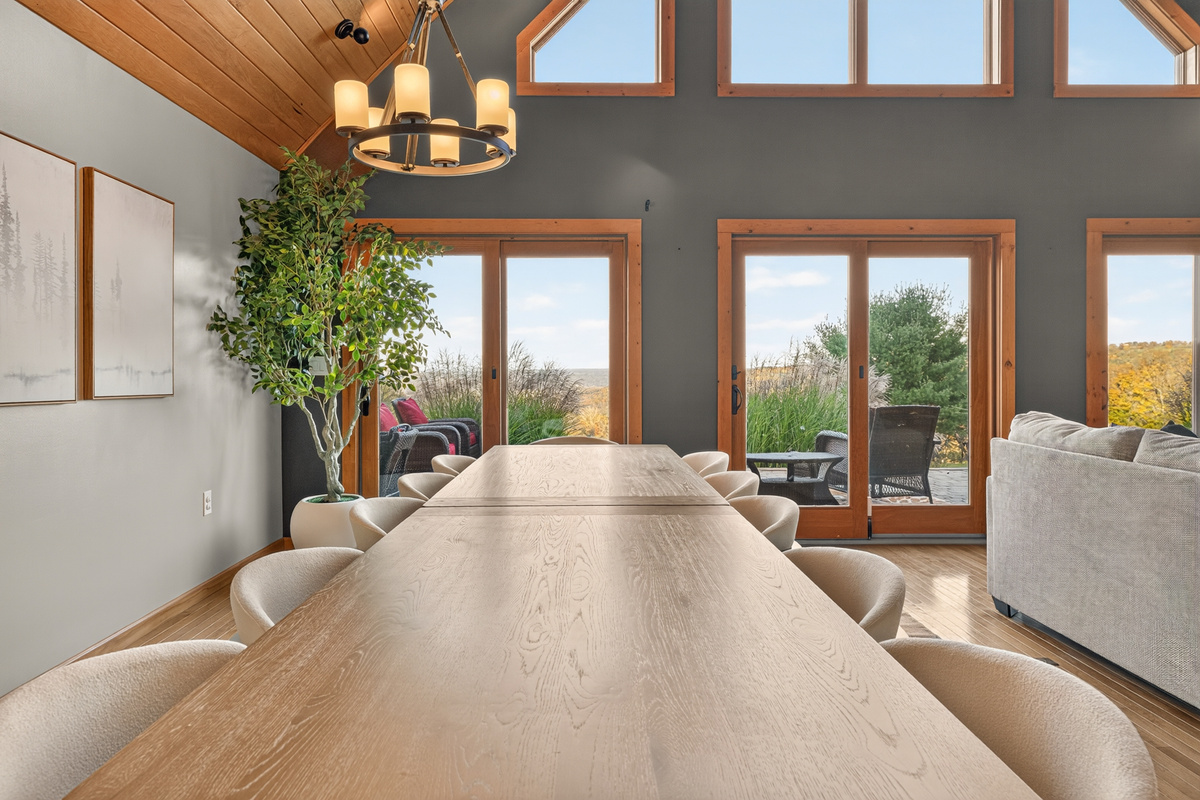 Long dining table with views through glass doors