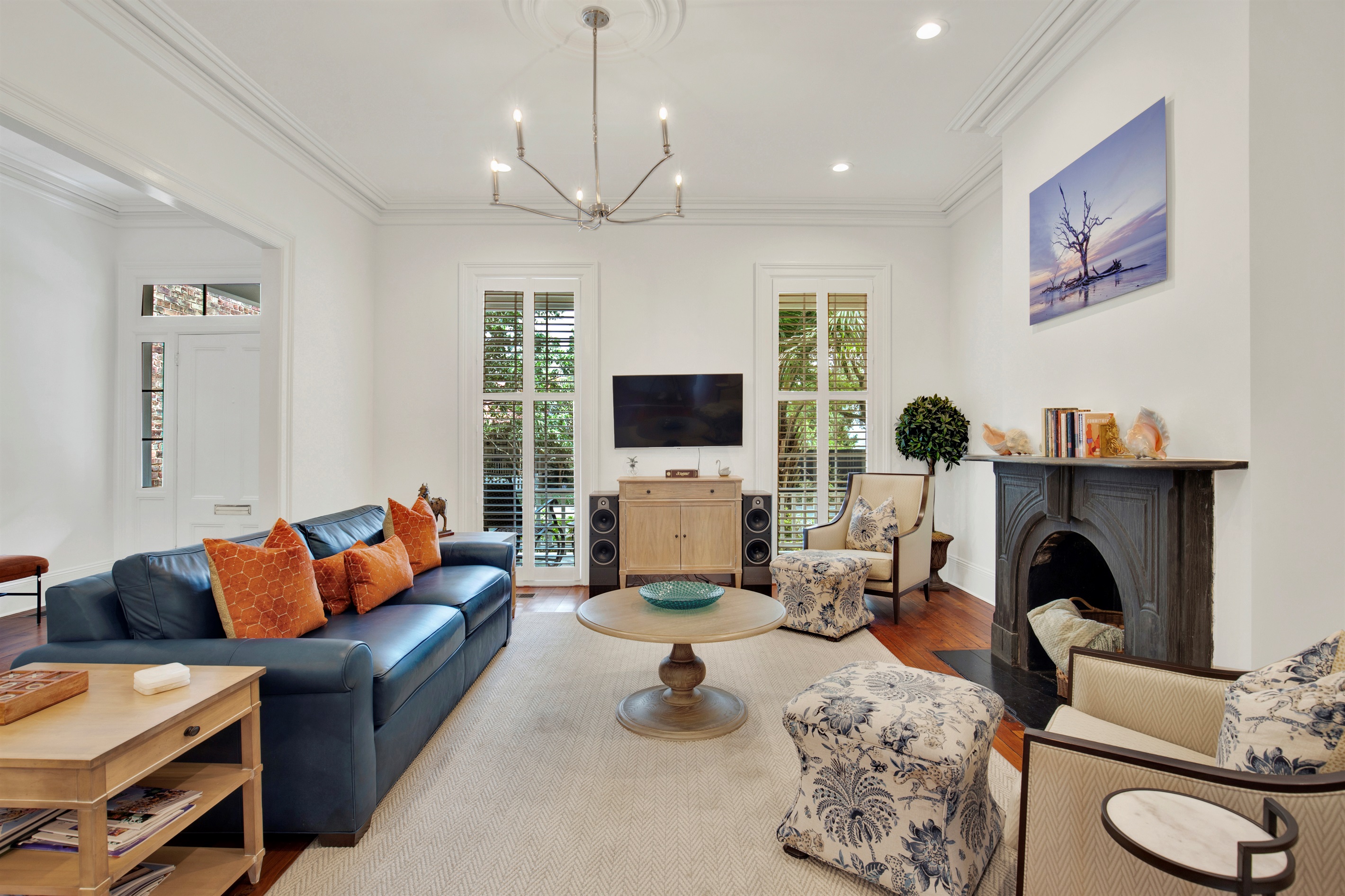 Ornate fireplace + architectural details from a bygone era.