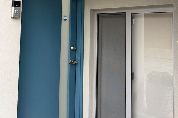 Covered front entry with a video doorbell, keeping arrivals easy and secure
