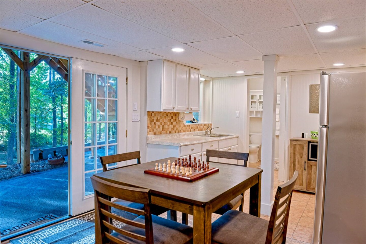 Open the French Doors to let in some fresh air and even more natural light in the basement Kitchen and Dining Space. 