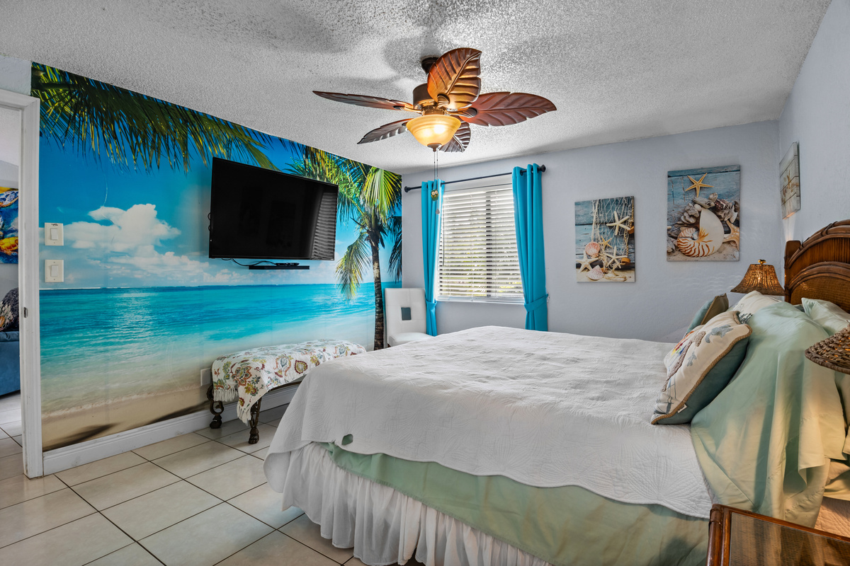 Bedroom 2. Includes a 55 inch smart TV.