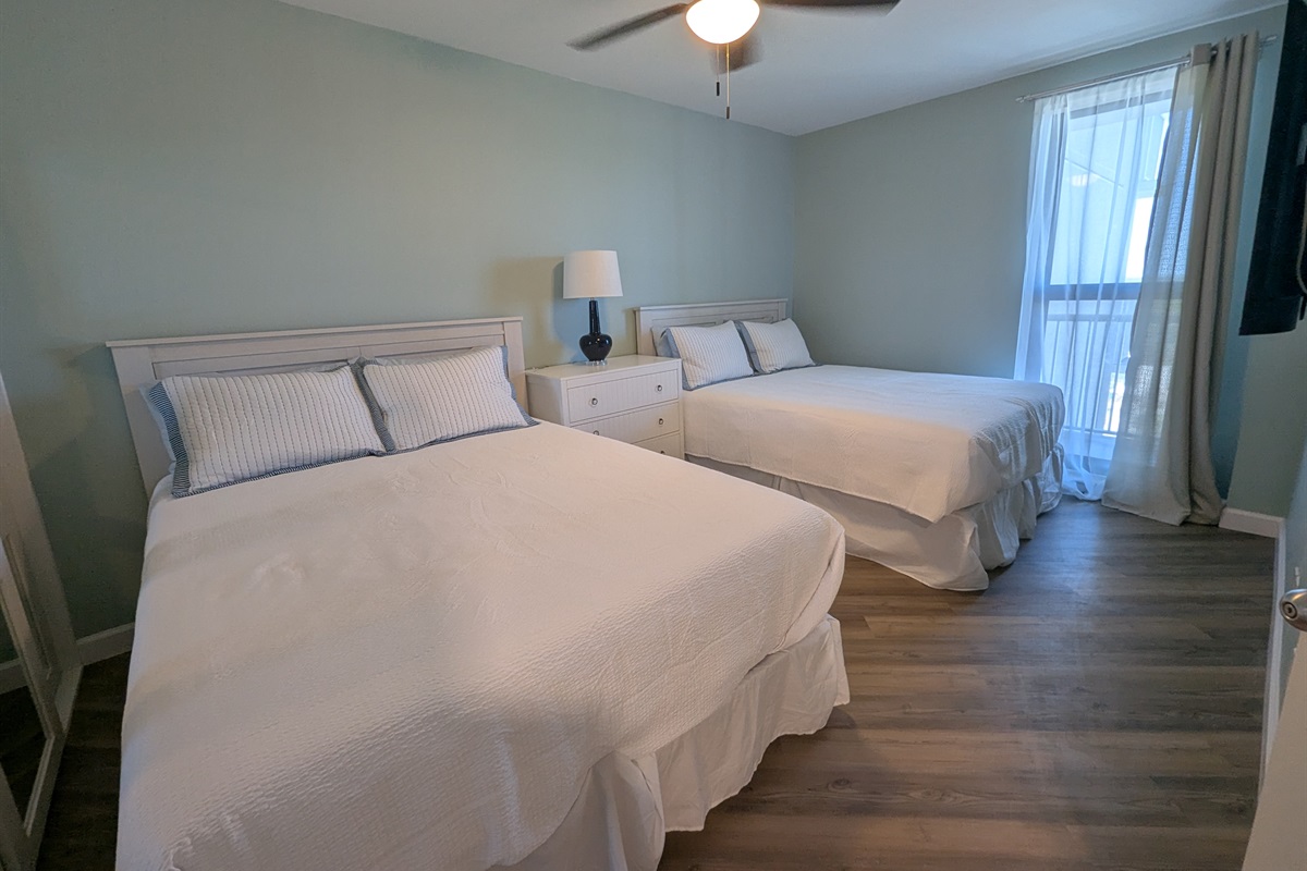 Dual queen beds taken from the doorway