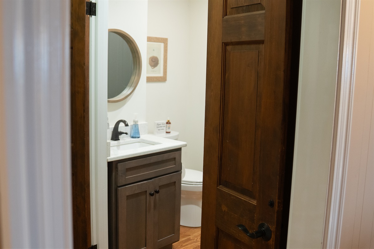 A convenient half bath is located on the main level for easy guest access.