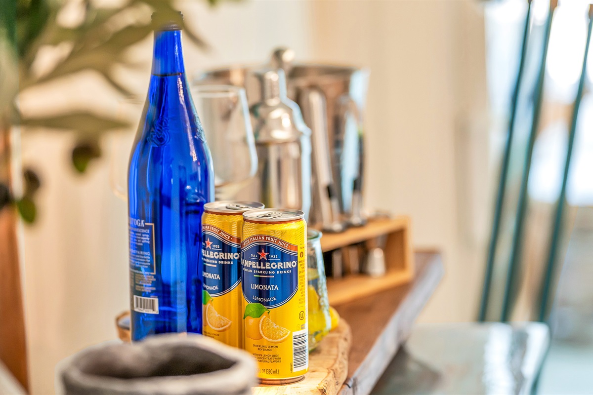 A thoughtful welcome awaits- refreshing beverages ad coastal touches set the tone for a relaxing stay in this beautifully curated Jupiter getaway