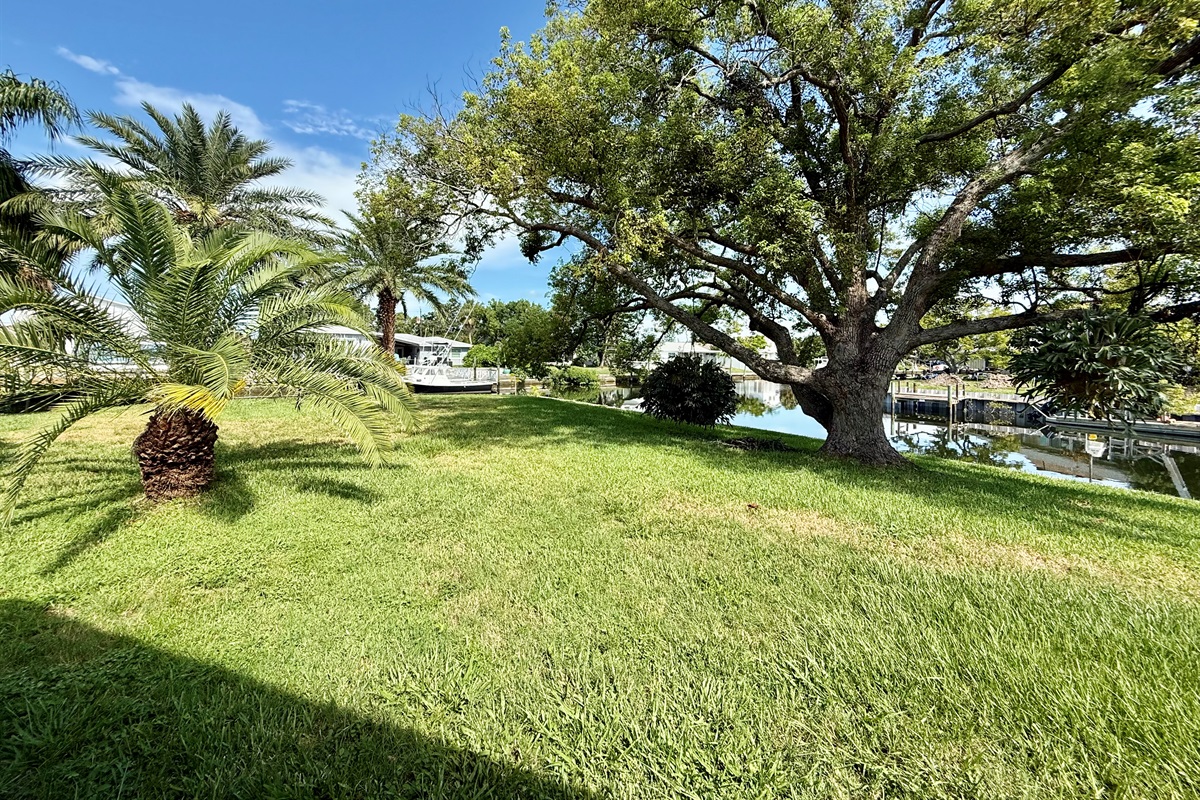 This wide-open green space backs directly onto a navigable canal, offering both beauty and adventure right outside your door.