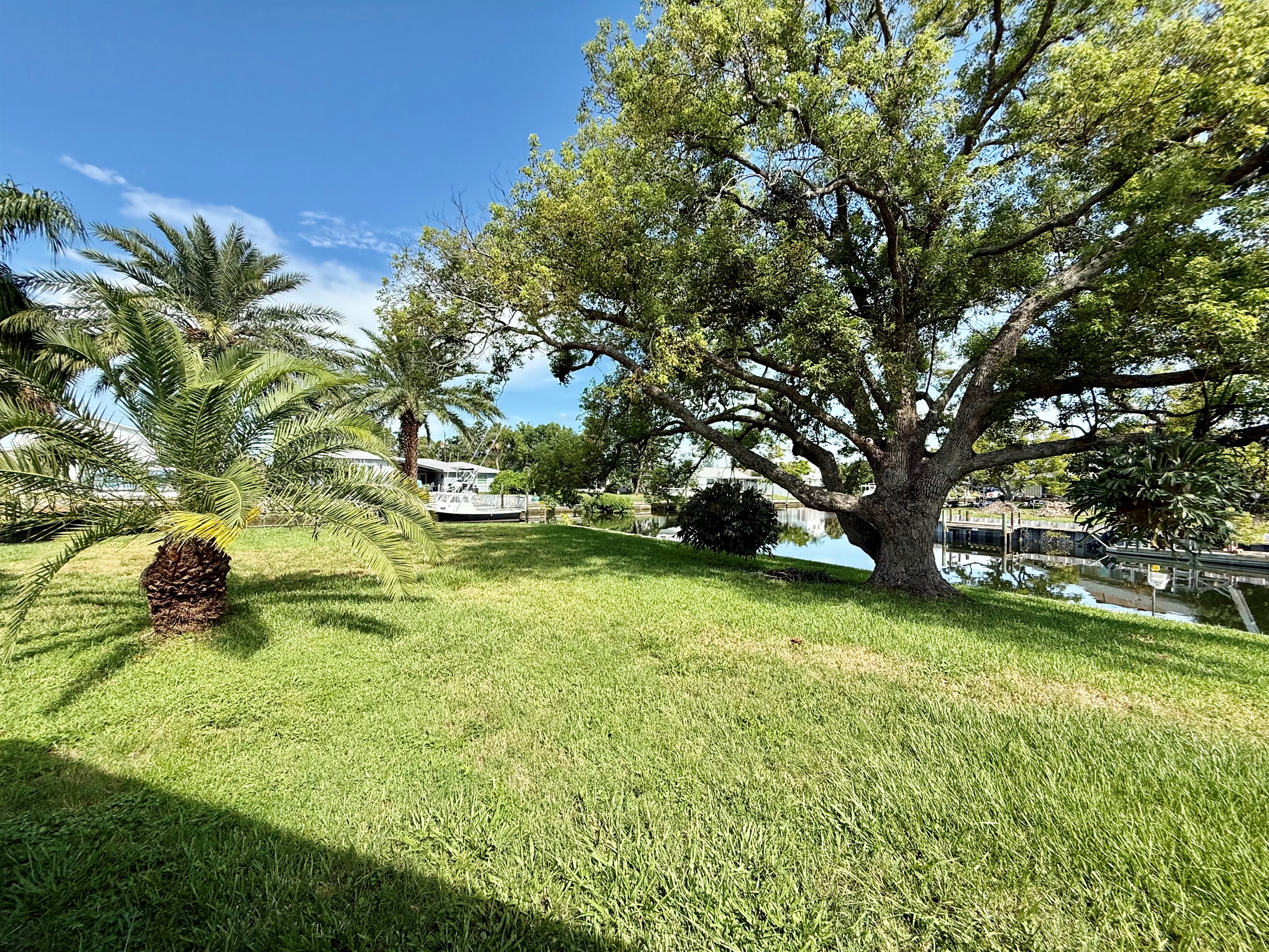This wide-open green space backs directly onto a navigable canal, offering both beauty and adventure right outside your door.