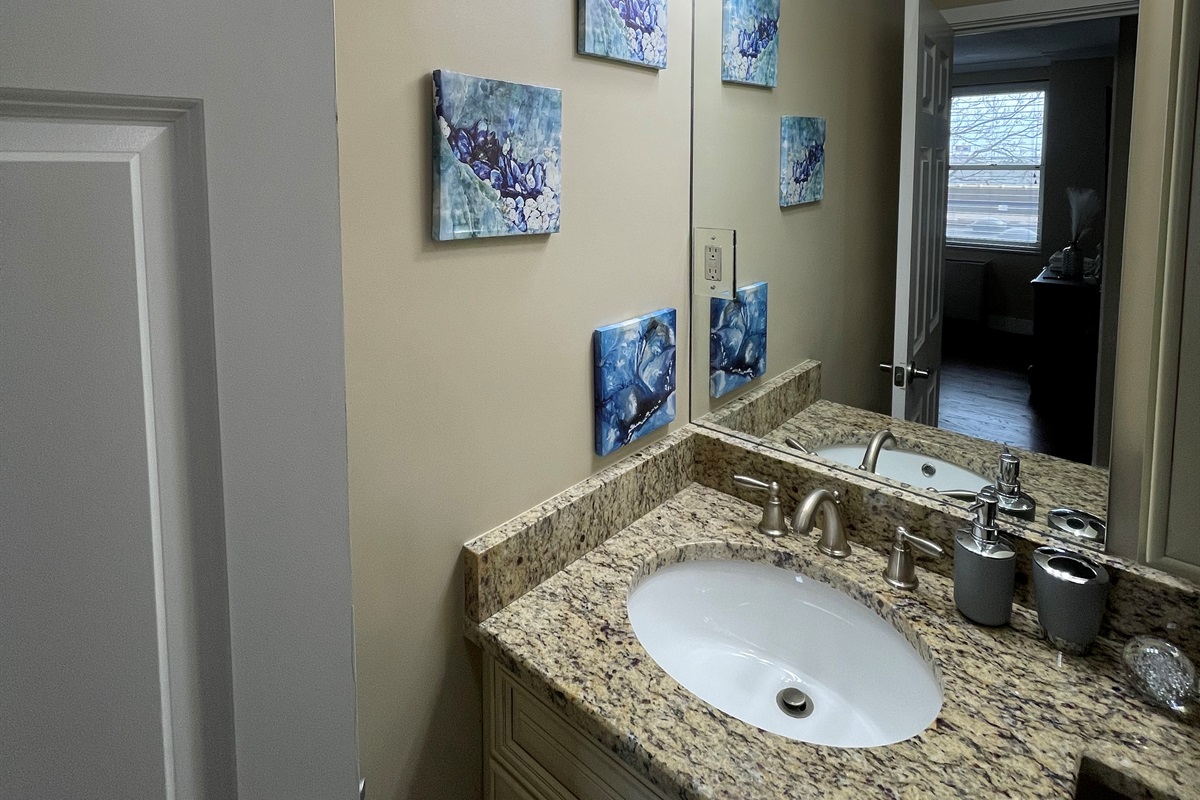 Master bath vanity w/ granite counter & sink for easy morning routines.