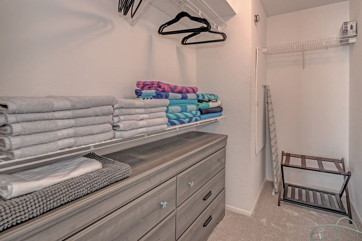 Walk in closet off the primary bedroom. This space fits a pack n' play perfectly! 