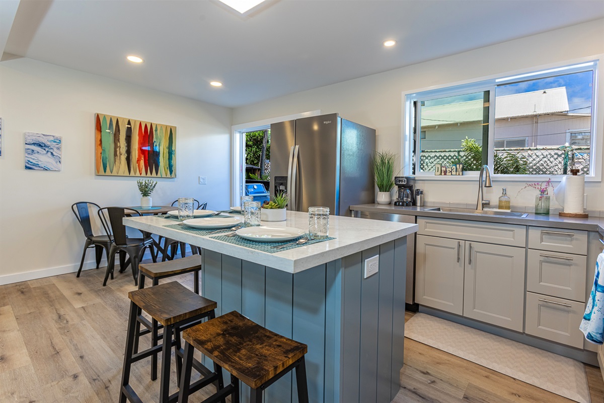 Large Window and Glass Sliders Allow for Plenty of Light and Natural Breezes