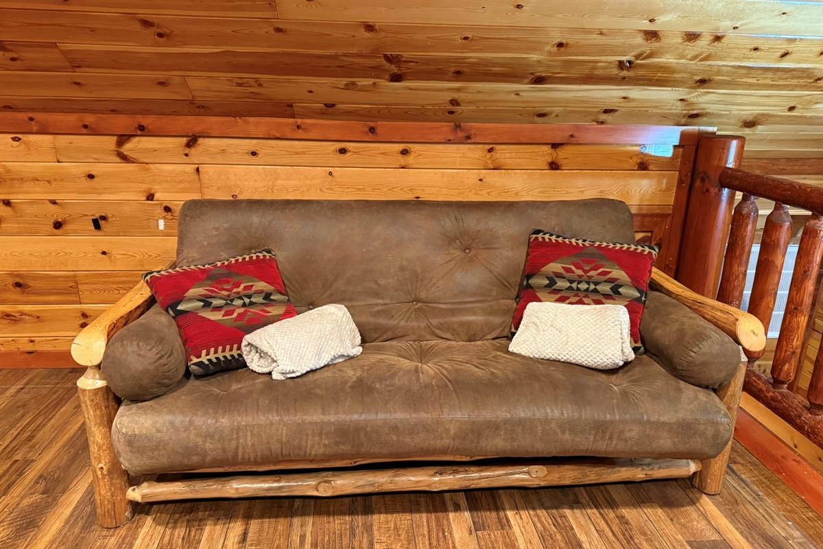 The comfy futon provides another sleeping space for your group to spread out.