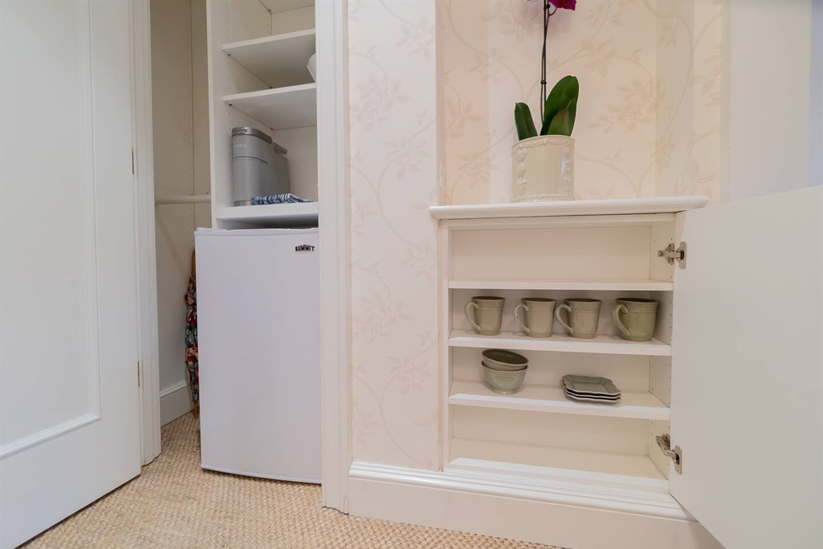 Storage for cups, bowls and small plates.