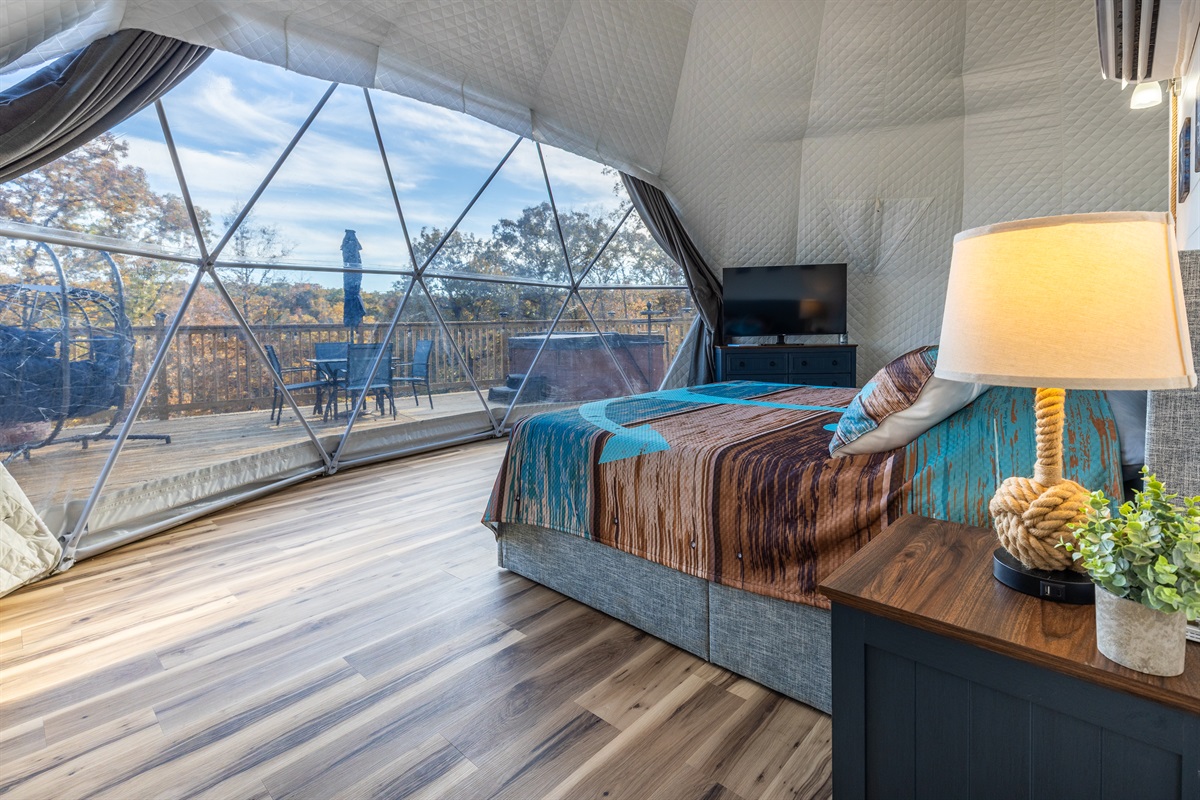 Wake up to panoramic lake views from your cozy king bed inside this luxury geodome retreat.