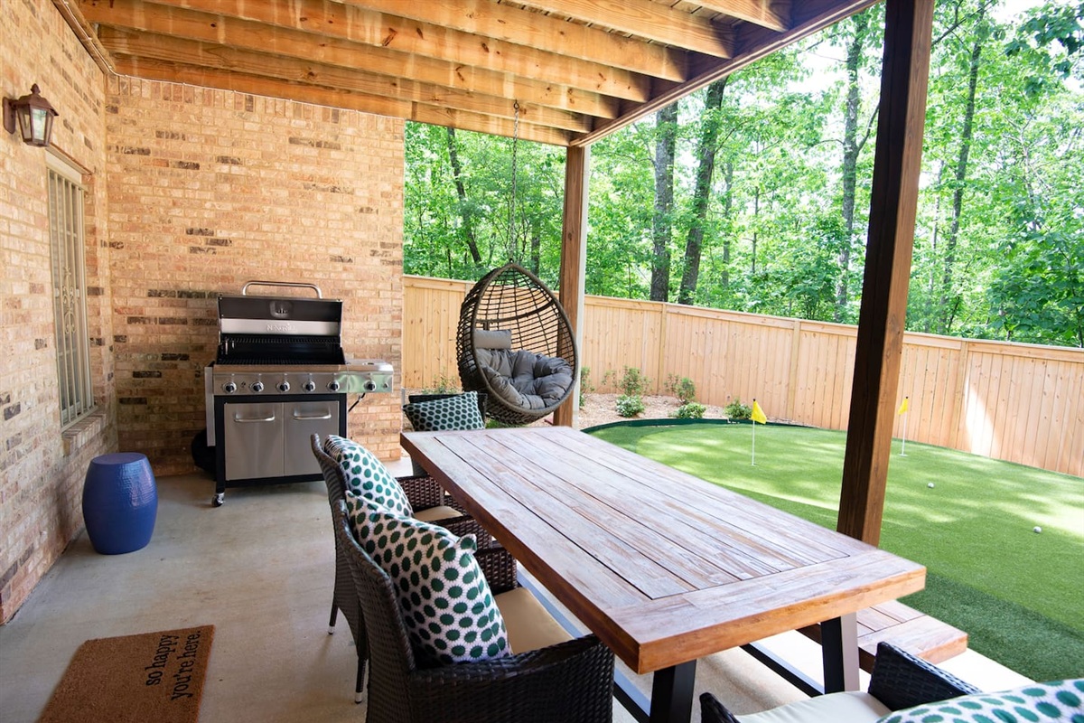 Downstairs patio - Grill out while you enjoy the picnic seating with friends, or get in a little putting practice
