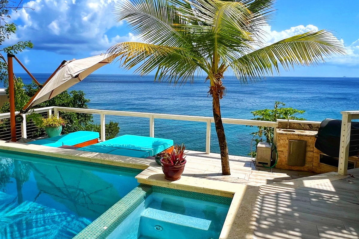 You have it all. The photo ops, the lounging, the views, the sounds of the ocean, the warm Caribbean breeze, and a relaxing pool. Please note the area next to the pool is NOT a hot tub. The only water amenity offered is the pool.