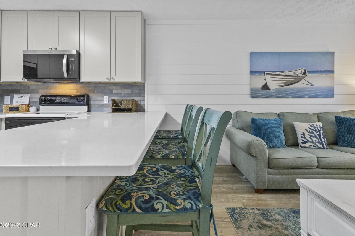Enjoy home-cooked meals with an open kitchen and dining space, making it easy to gather together after a fun day at the beach.