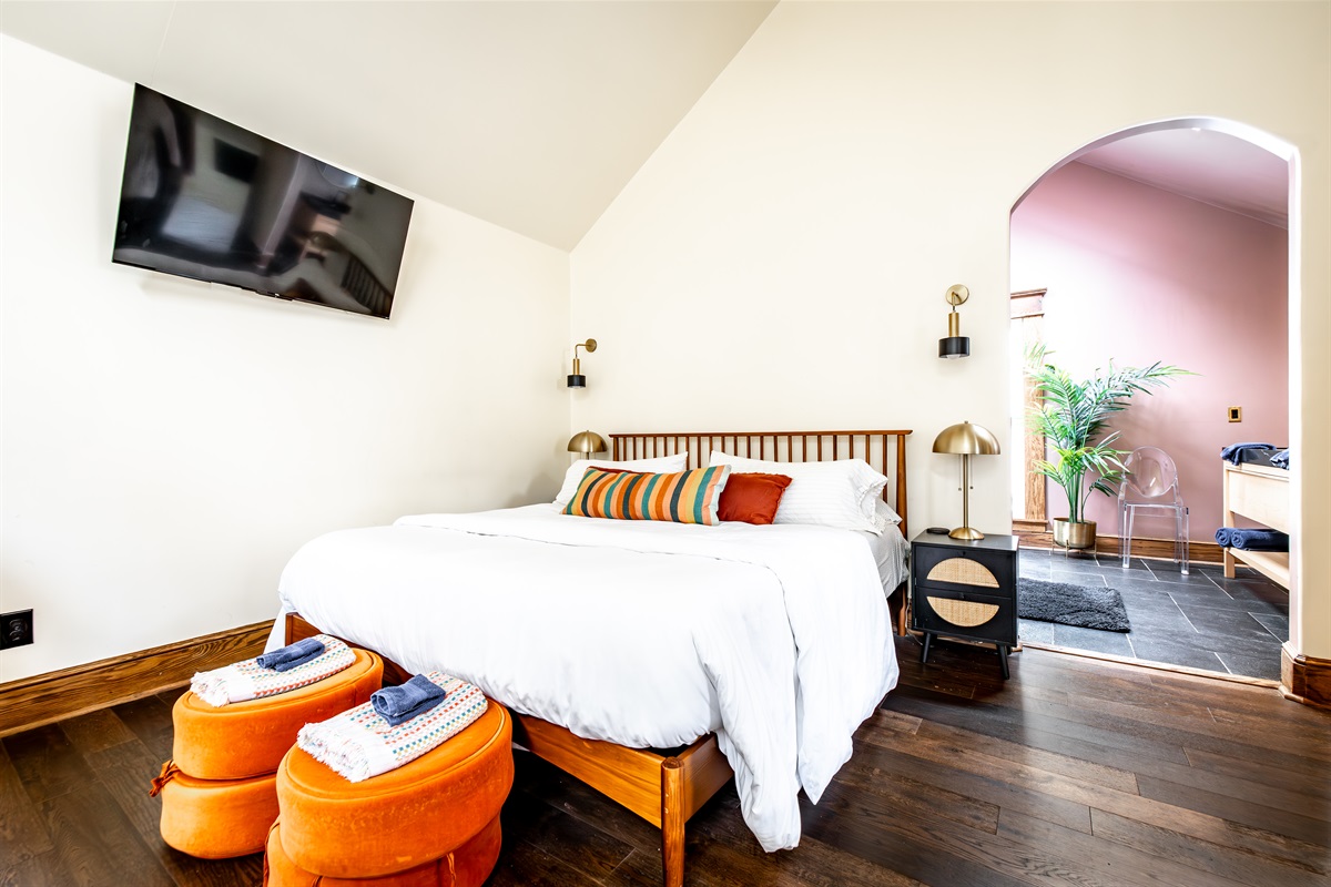 Perfectly mounted 50" TV for relaxing and winding down when you head to bed.