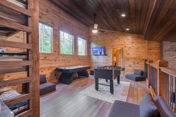 Multiple game table options in the upstairs bunkroom/gameroom