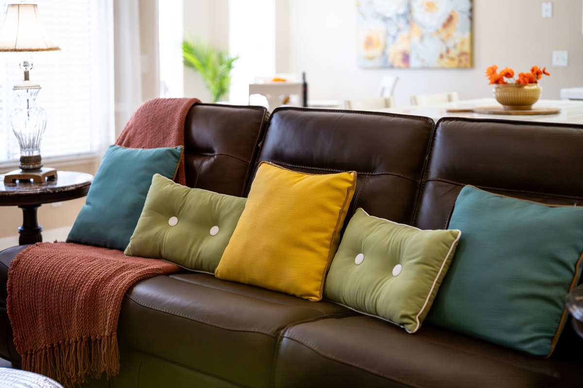 Bright, inviting, and designed for connection, the living room provides ample seating for everyone to relax together.