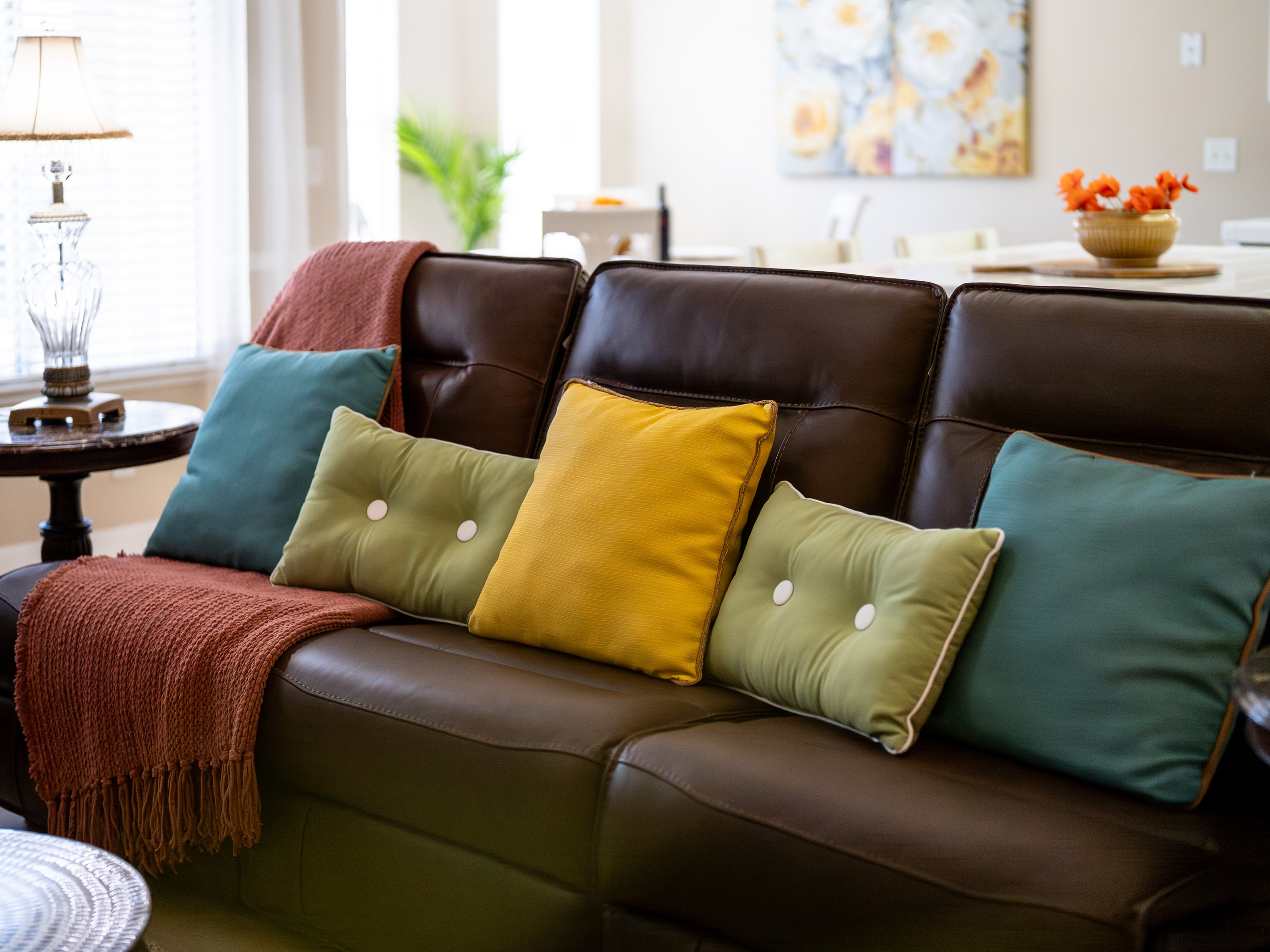 Bright, inviting, and designed for connection, the living room provides ample seating for everyone to relax together.