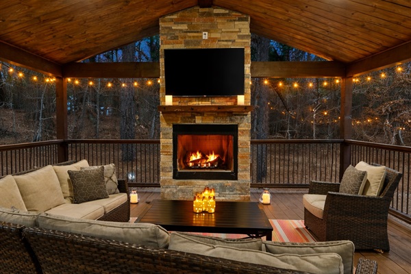 Covered porch with fireplace — your go-to spot for cozy evenings year-round