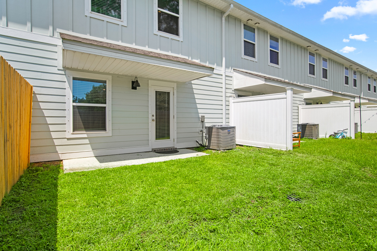 The left side of the backyard is open to neighboring units.