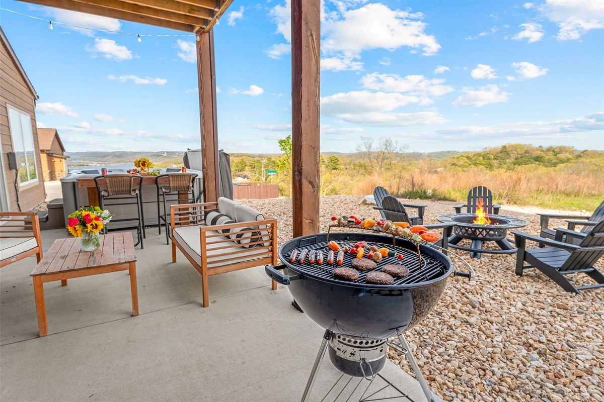 Relax on the covered patio with comfortable seating, lake views, and a grill for outdoor meals.