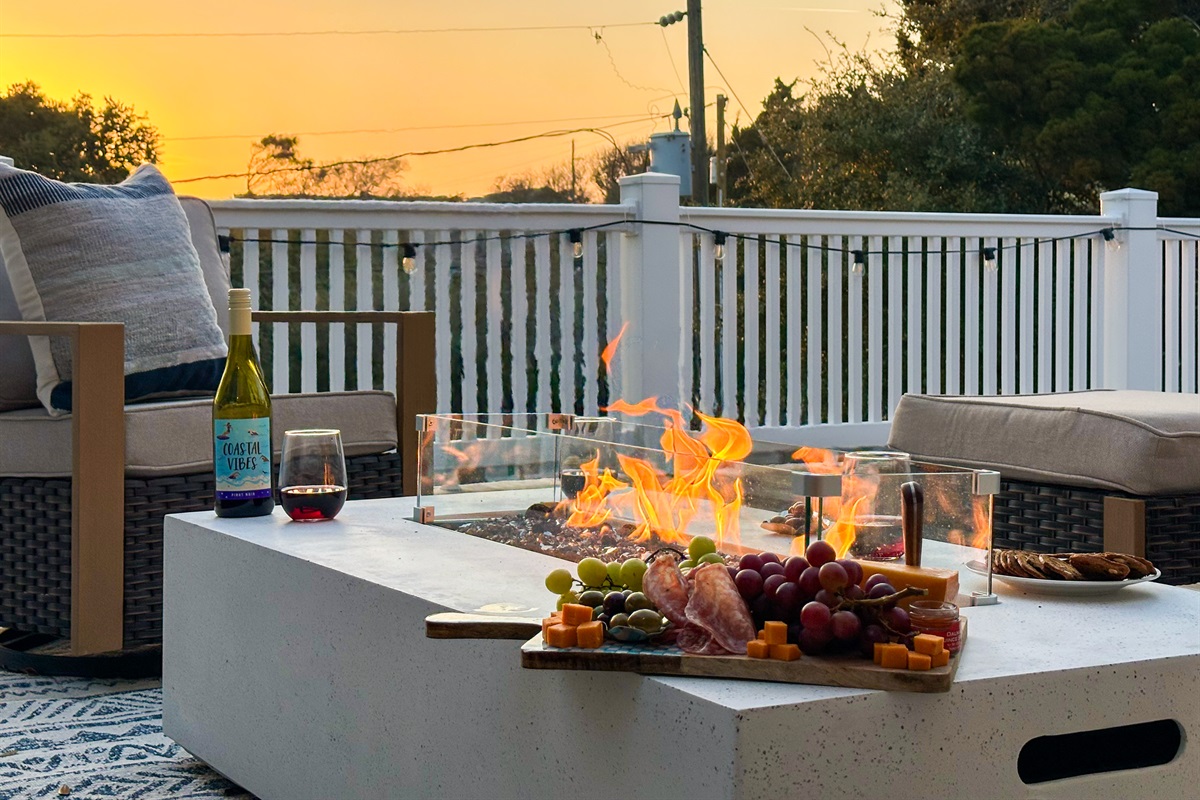 After a day on the beach, gather by the fire with a great glass of wine.