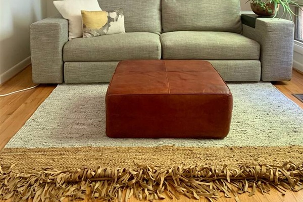 This couch is also a bed. Made by Resource Furniture and designed in Italy, here's how it works: a queen size bed folds and sits on top of the couch to to transform this room into a fourth bedroom. Murphy bed currently available by request only.