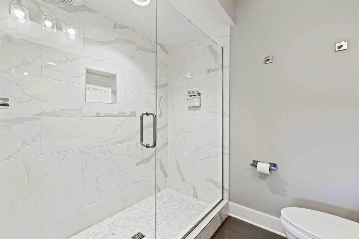 Large walk-in showers with rainheads in every bathroom. Each bathroom is modern and has beautiful bright lighting, another perk for getting ready with your girls.