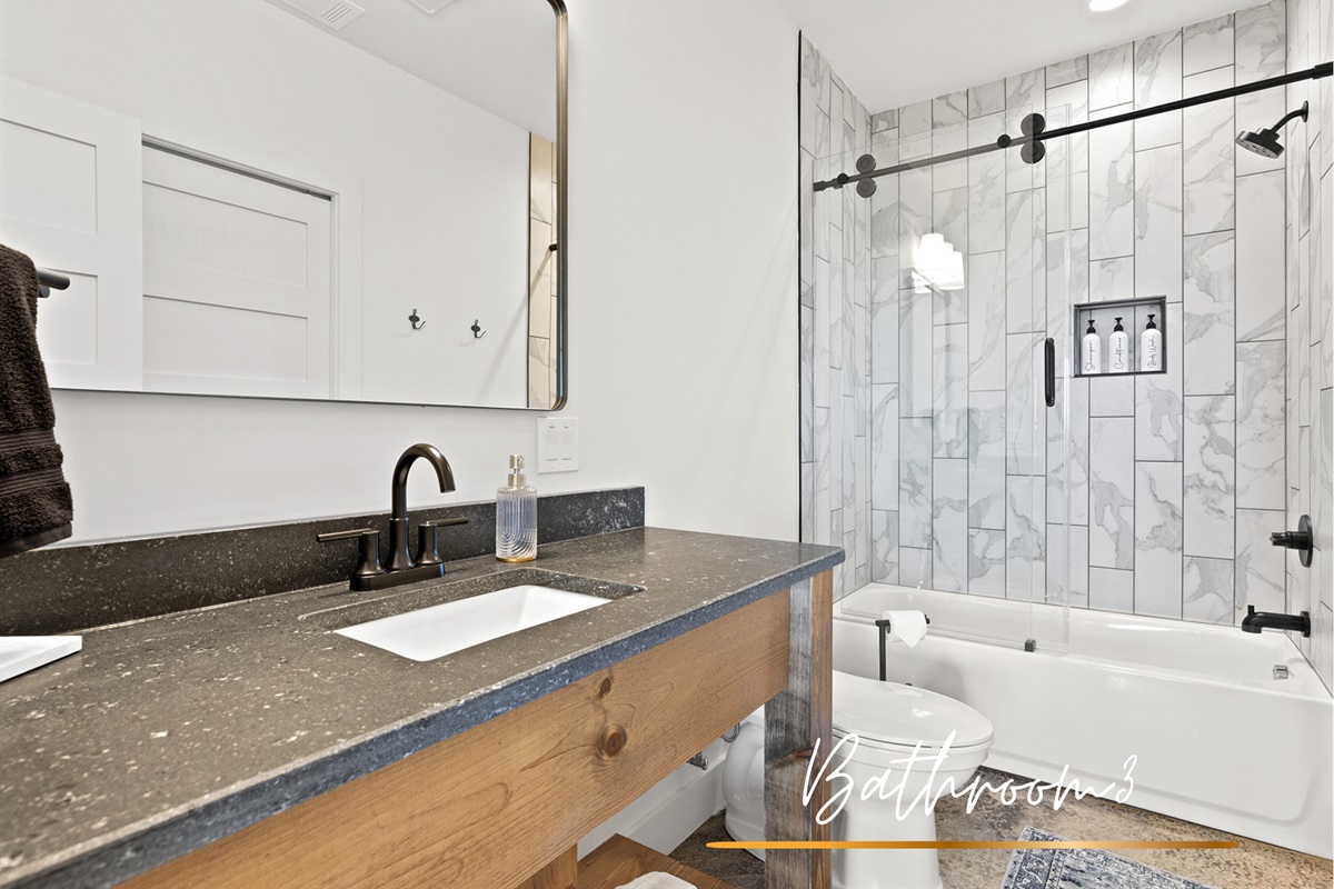 A modern retreat featuring a sleek glass shower and earthy tones for a spa-like experience at home.