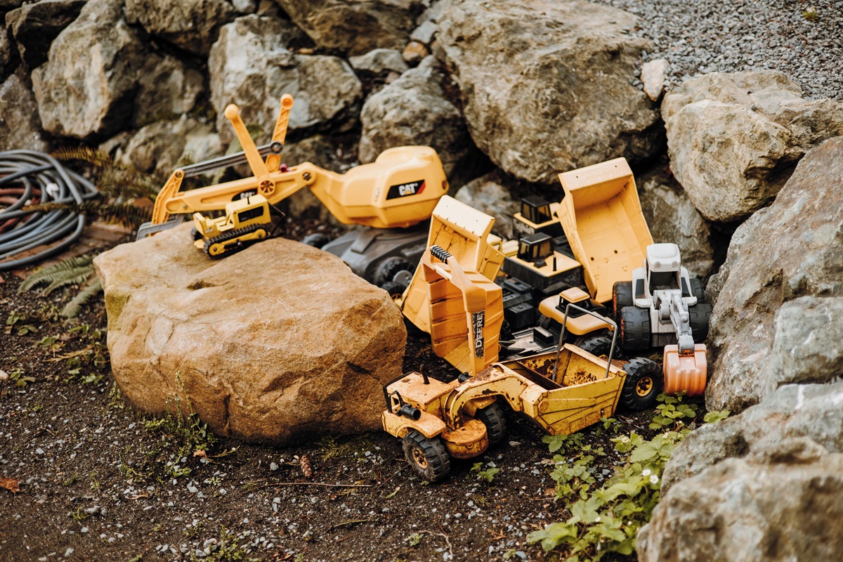 Toy trucks for children to enjoy playing in the dirt.