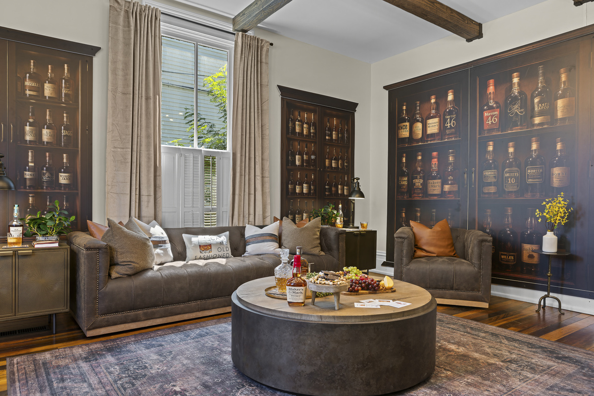 The floor-to-ceiling bourbon mural is a standout feature that always sparks conversation, inviting you to settle in, pour a drink, and take it all in.