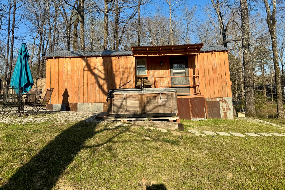 Front view of cabin and hot tub