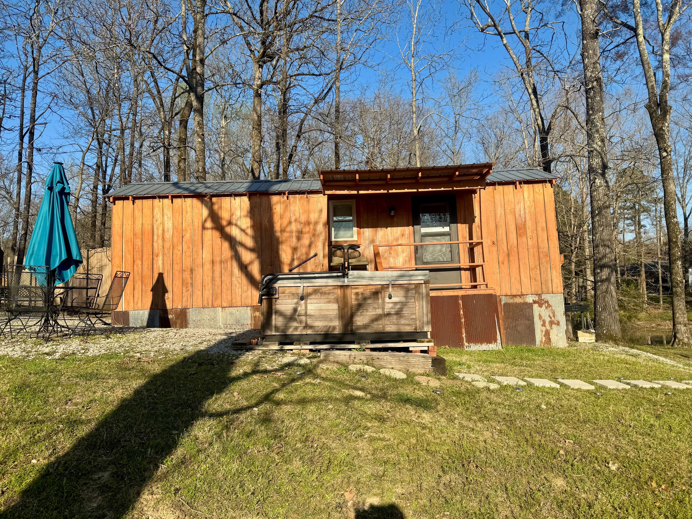 Front view of cabin and hot tub