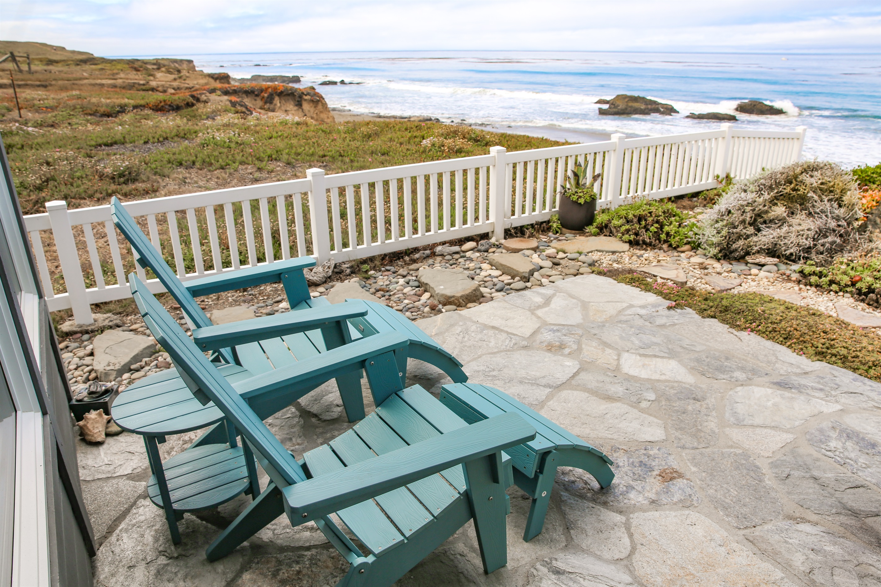 Seating for two on our patio to enjoy the ocean breeze
