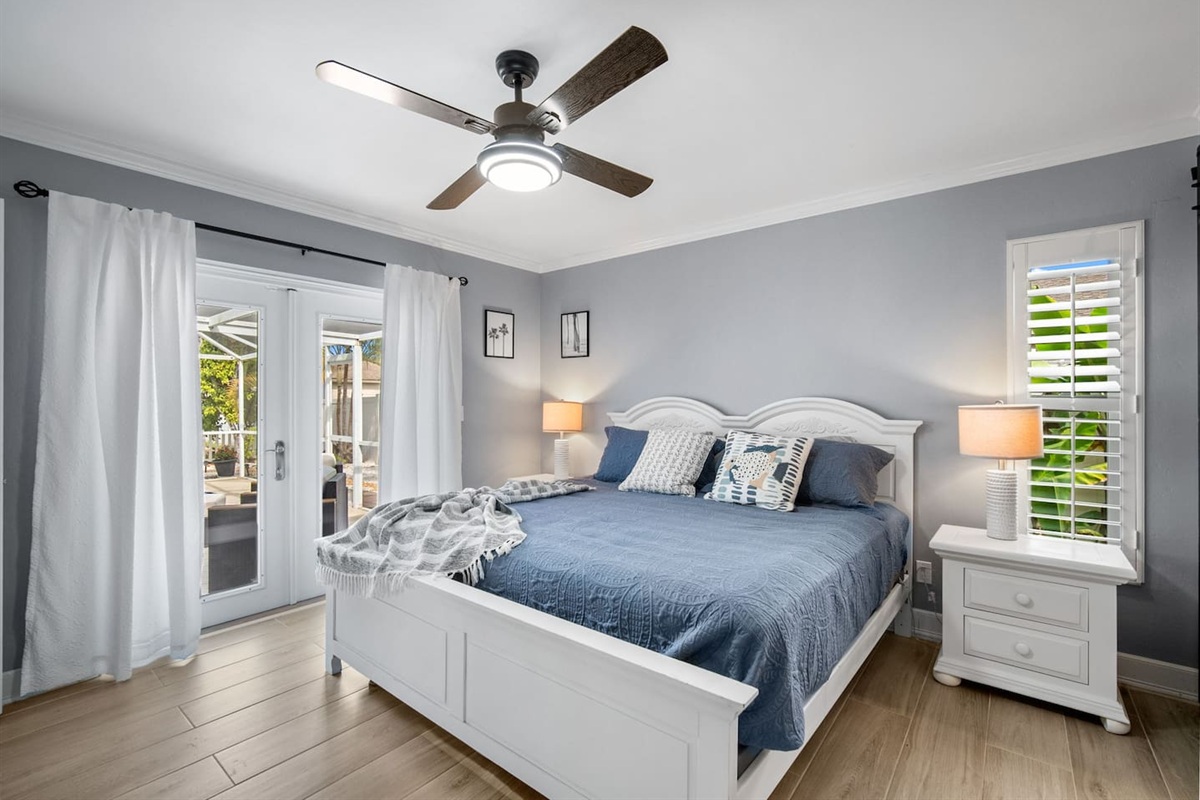 main bedroom with access to the lanai and the pool