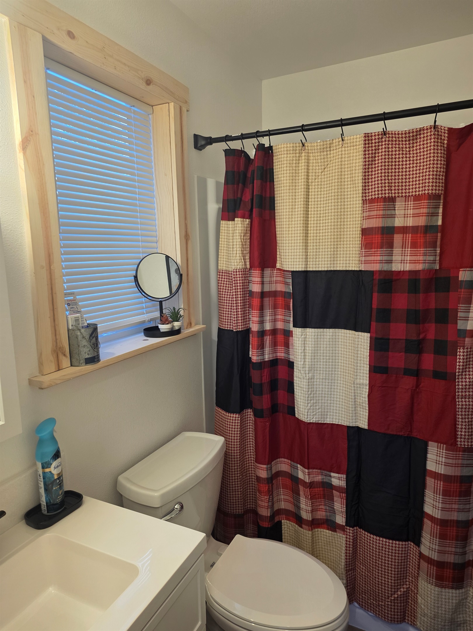Bathroom includes a vanity, toilet, and shower/tub combo.