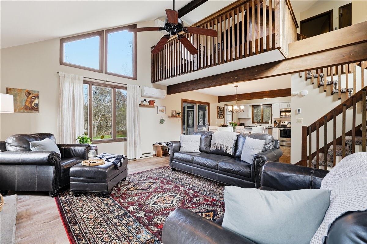 The open floor plan flows from the great room all the way up to the loft